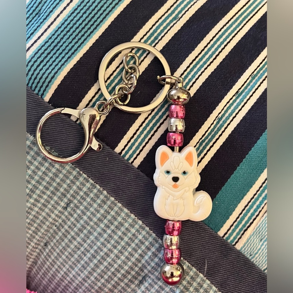 Adorable handmade husky beaded keychain .